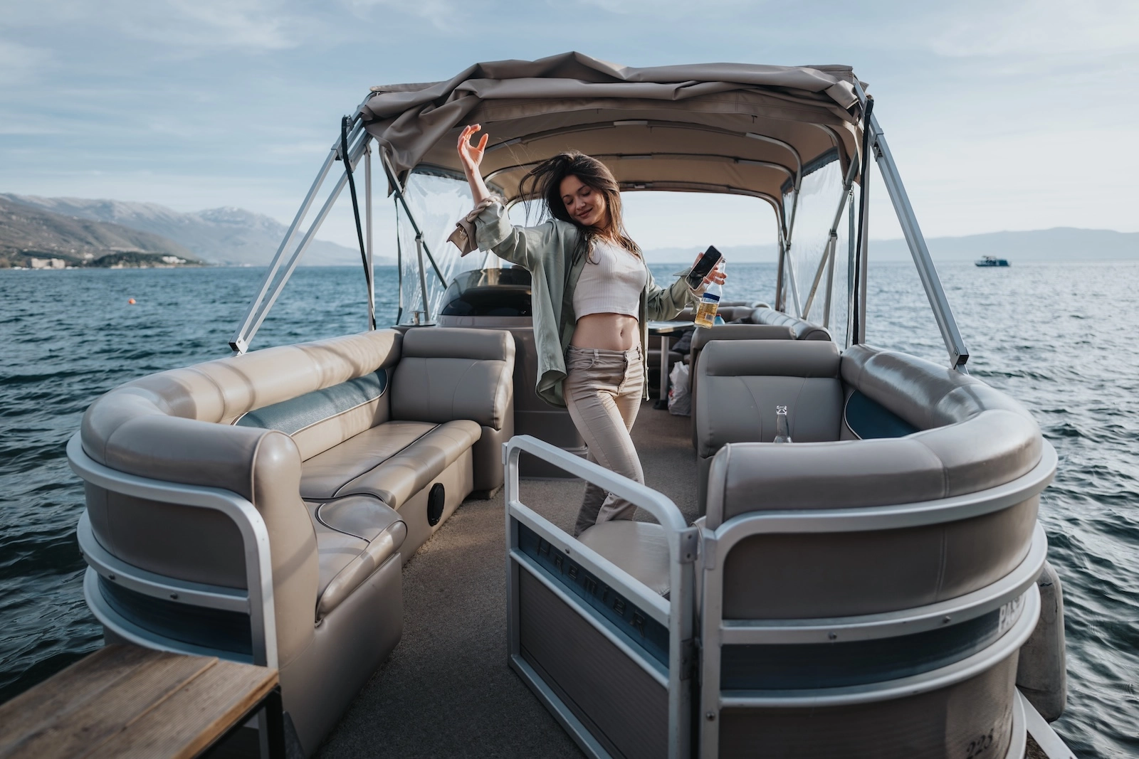 Pontoon boat cruising on calm waters